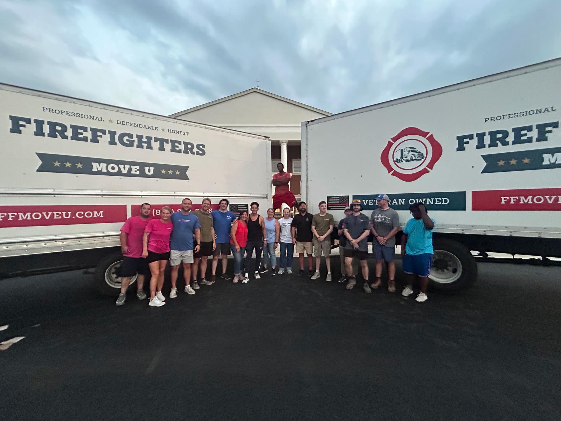 a crew of Firefighters Move U in front of their truck